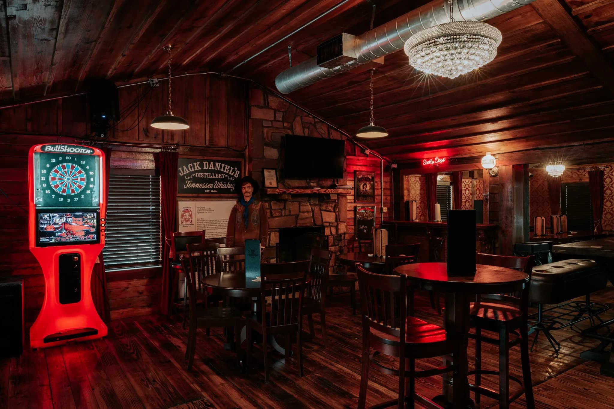 Scotty Doggs Hideout lounge with fireplace and dartboard